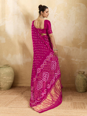 A pink saree with a bandhani pattern and a lagdi pallu design, 