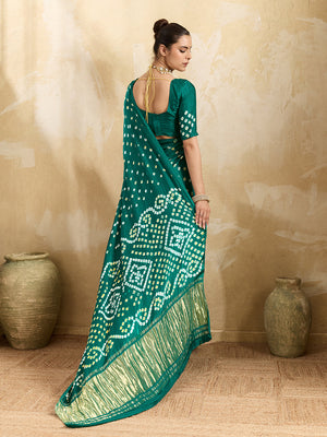  A traditional saree with a bandhani pattern in teal color,