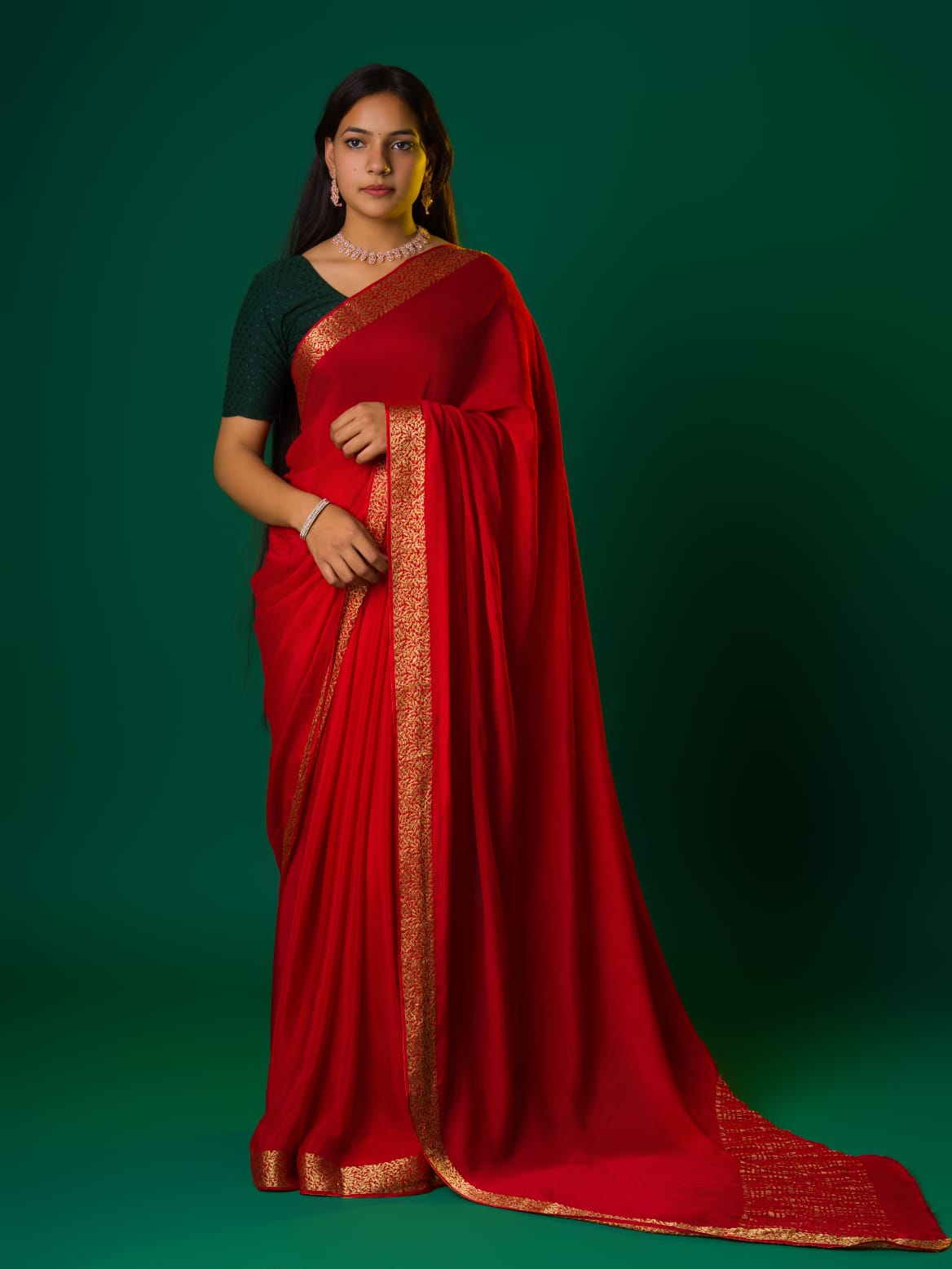A  red saree with a zari border