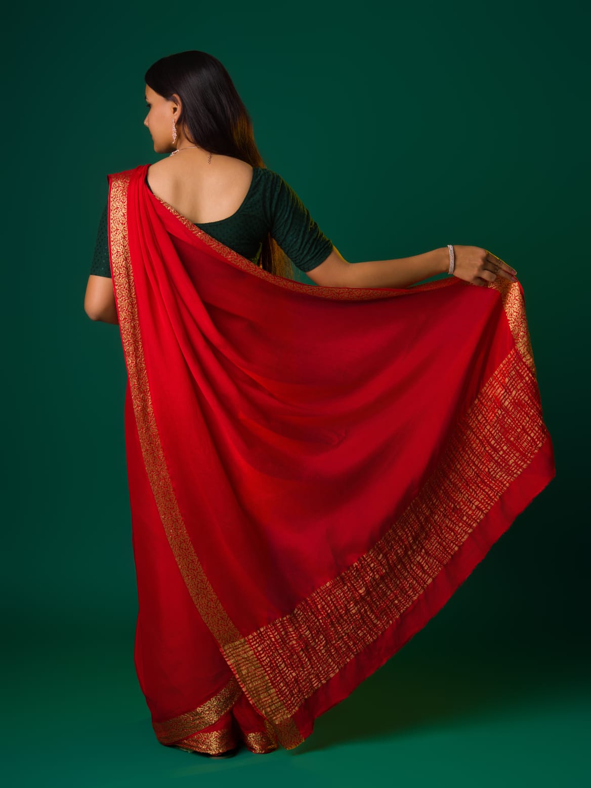 A  red saree with a zari border