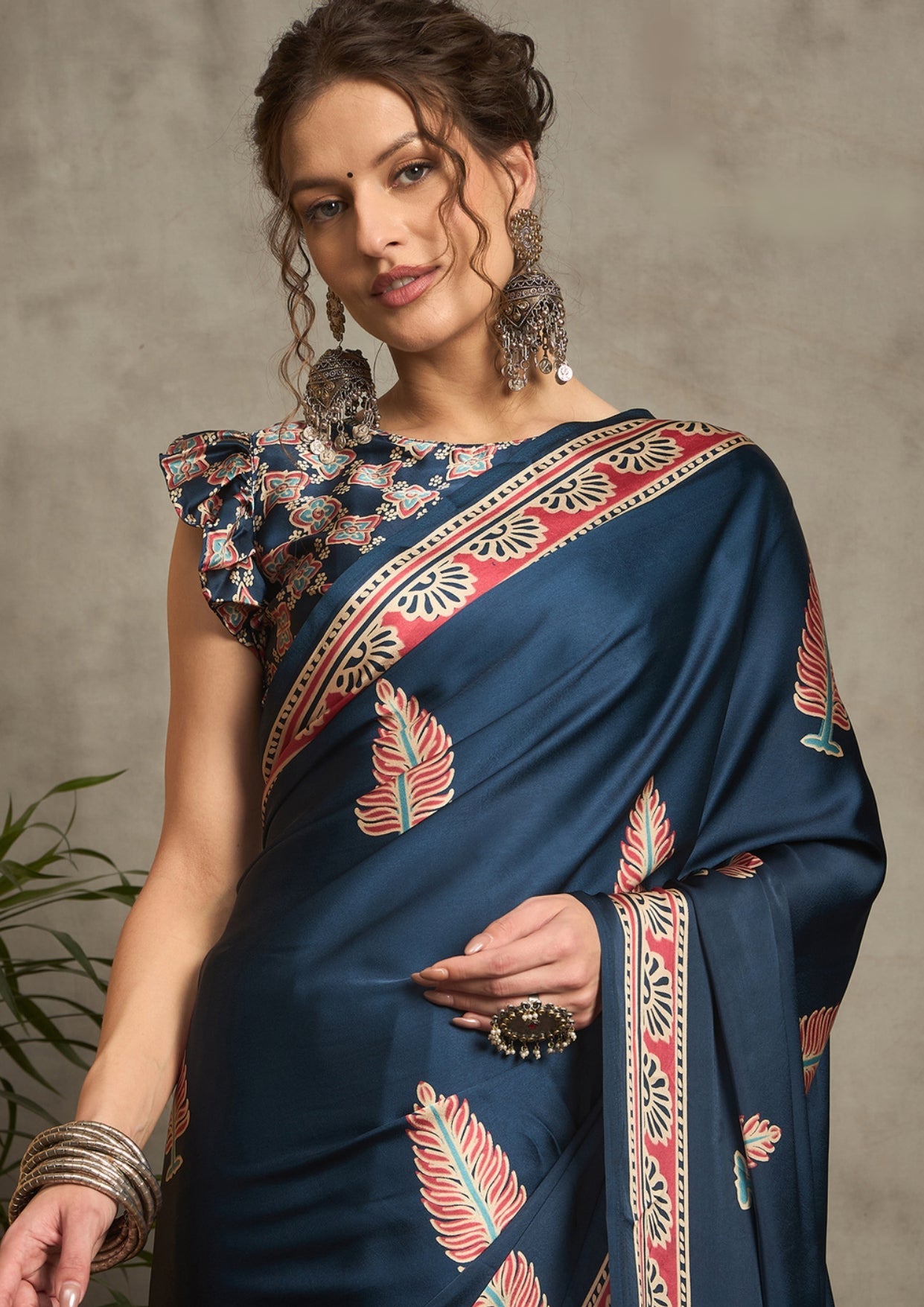 A blue saree with red and white floral ajrak print 