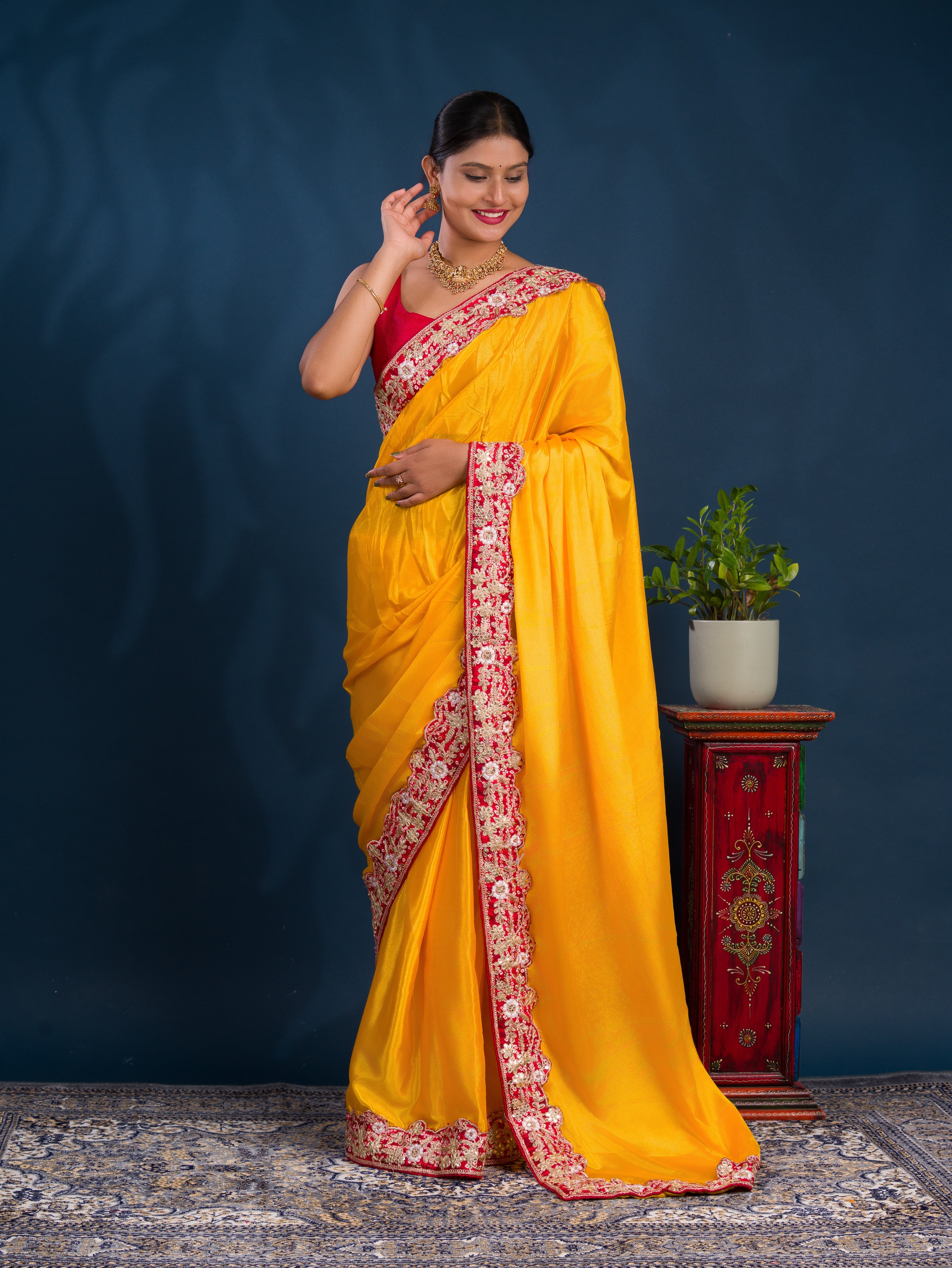 A yellow saree with red border  Chinon Silk Bollywood Style With Sequence Gotapatti Work Saree 