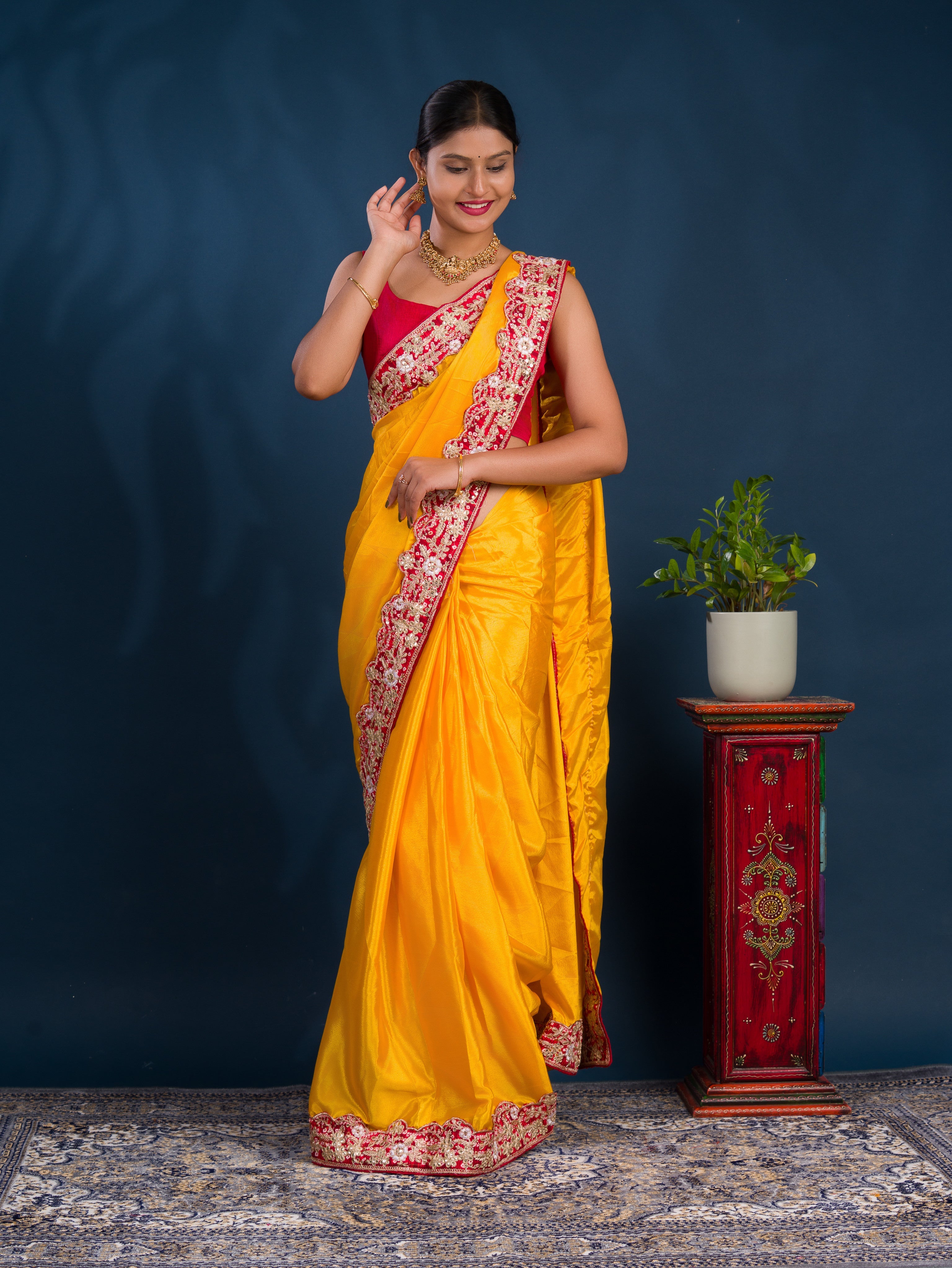 A yellow saree with red border  Chinon Silk Bollywood Style With Sequence Gotapatti Work Saree 