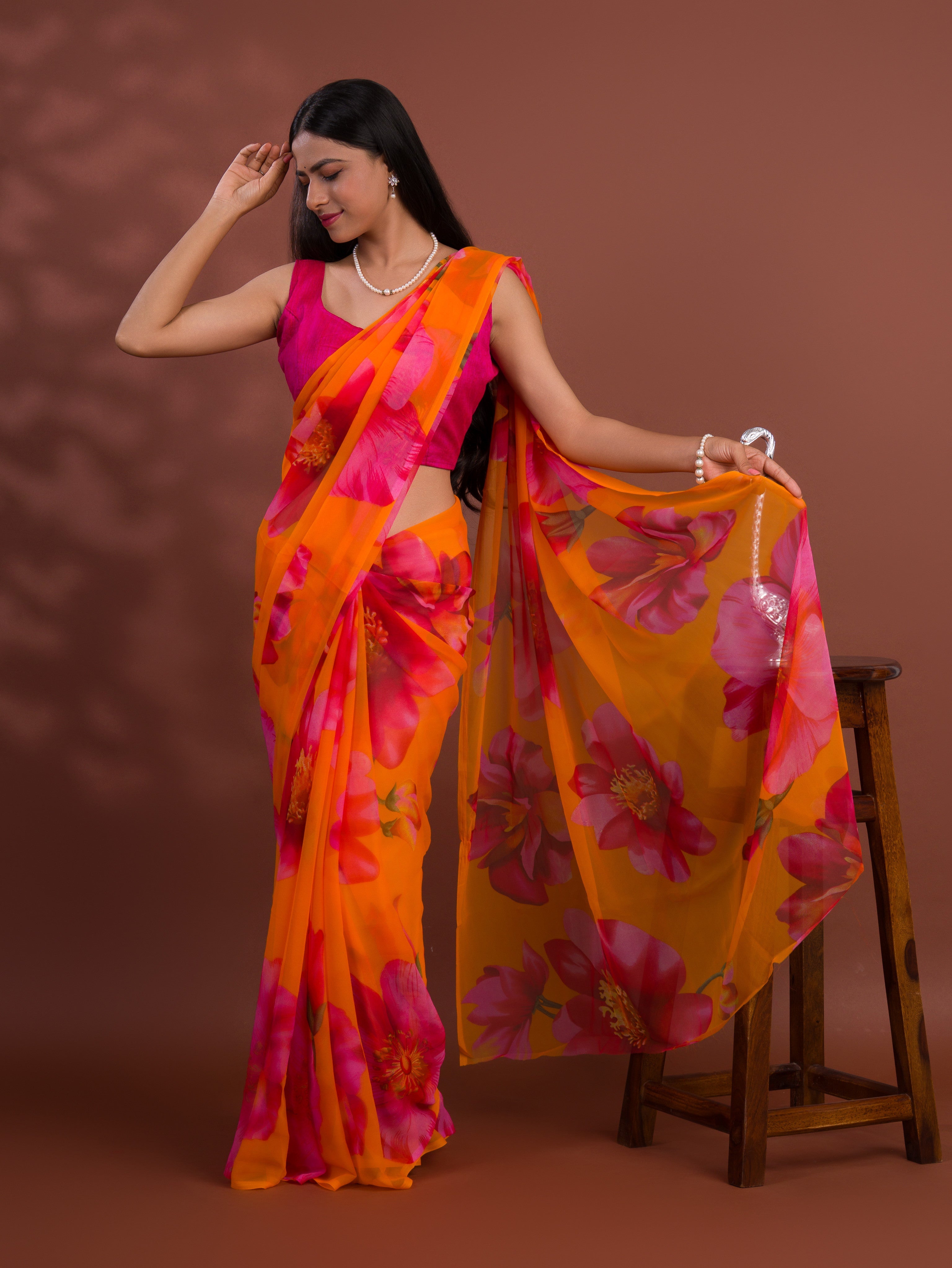 A vibrant orange and pink floral saree  Georgette Flower Printed Style 