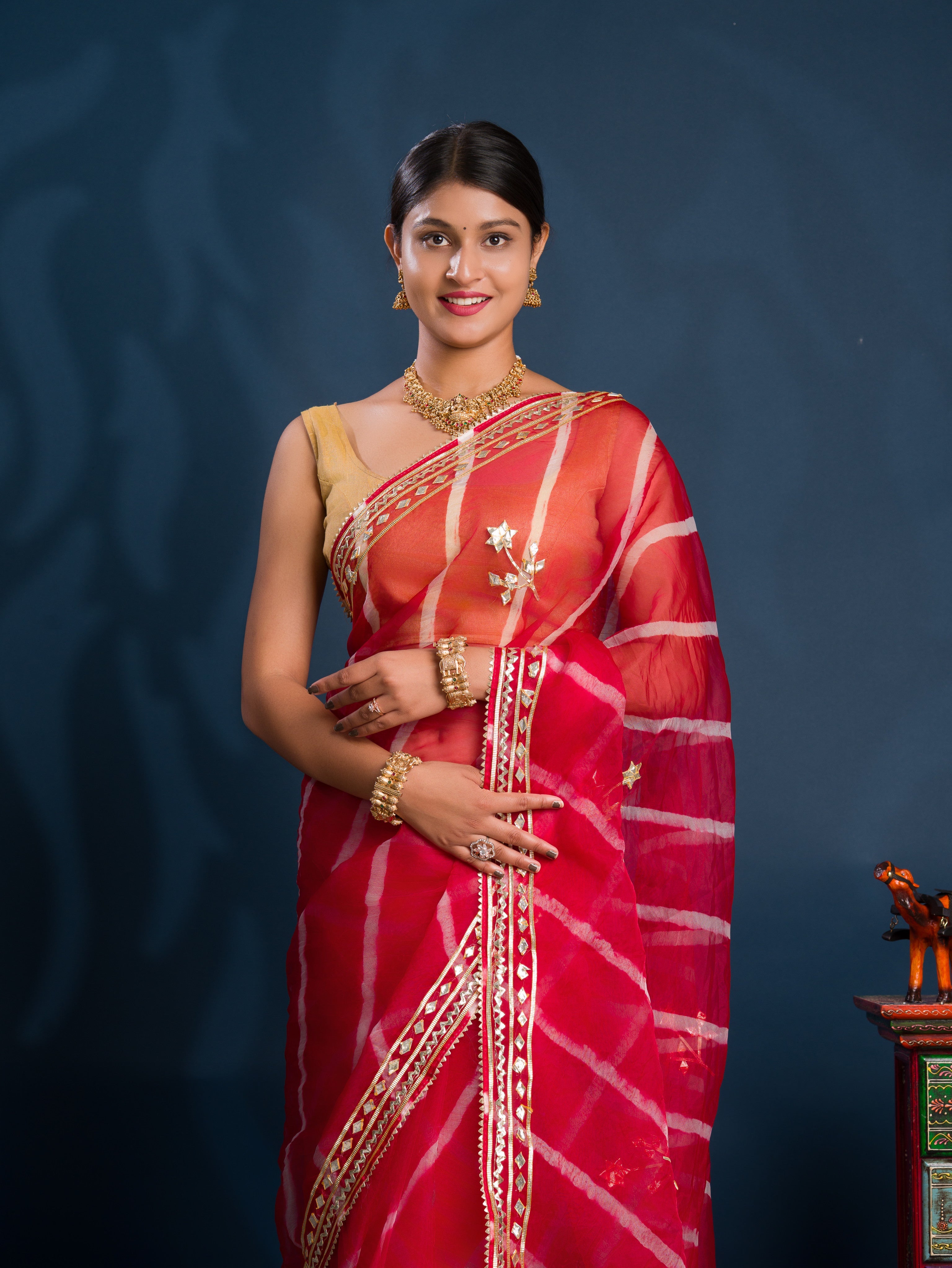 Red saree with gold patterns   Organza Leheriya Style With Gotapatti Work 