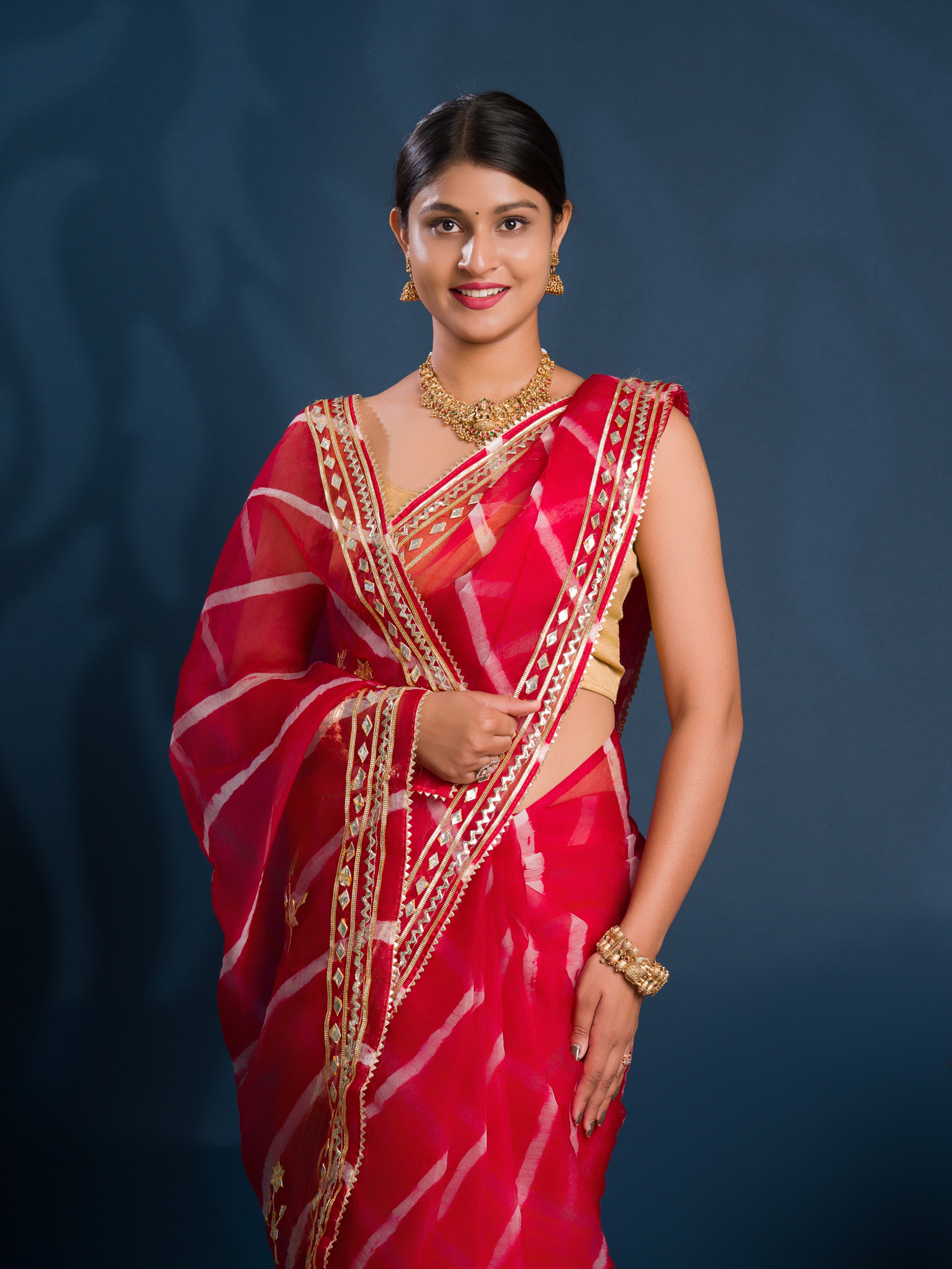 Red saree with gold patterns   Organza Leheriya Style With Gotapatti Work 