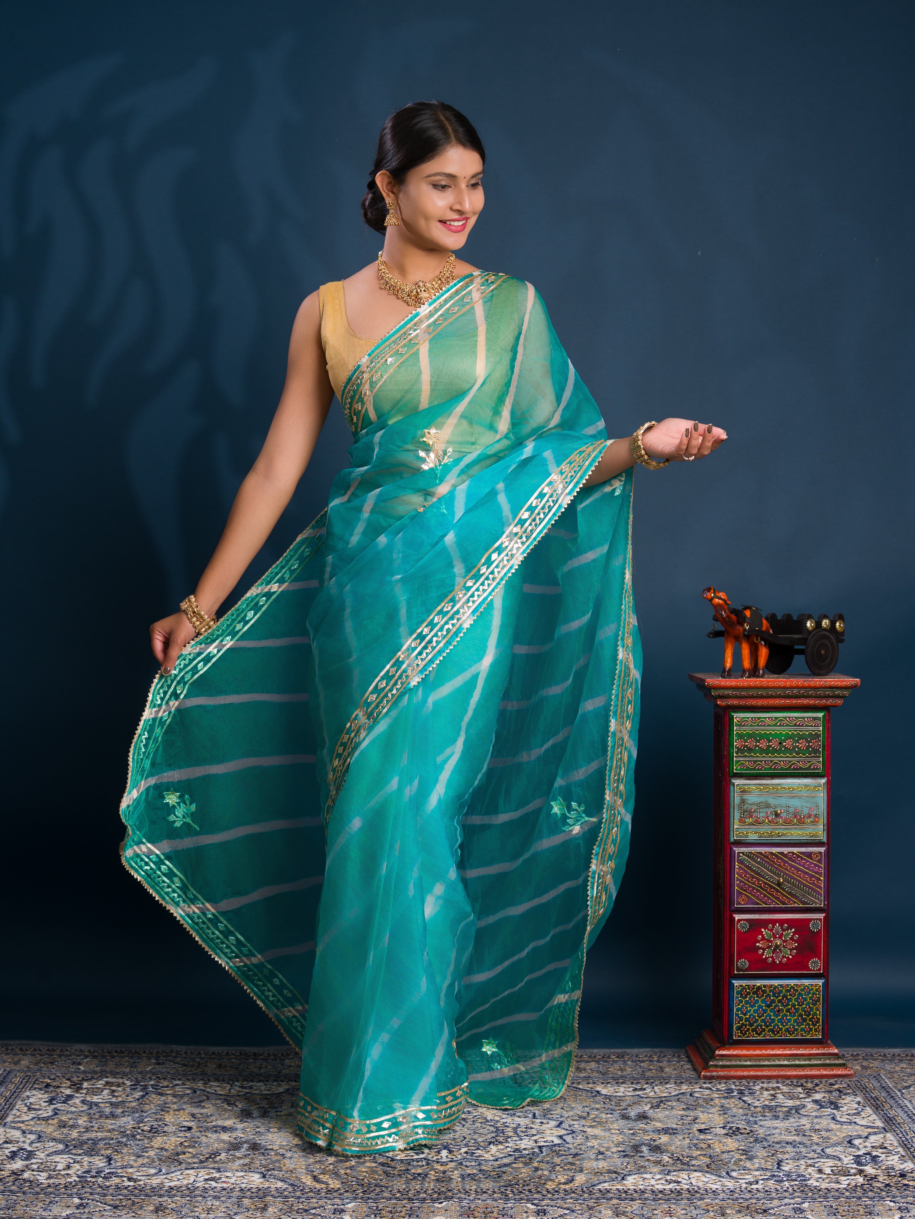 Teal sareewith Silver  patterns   Organza Leheriya Style With Gotapatti Work 