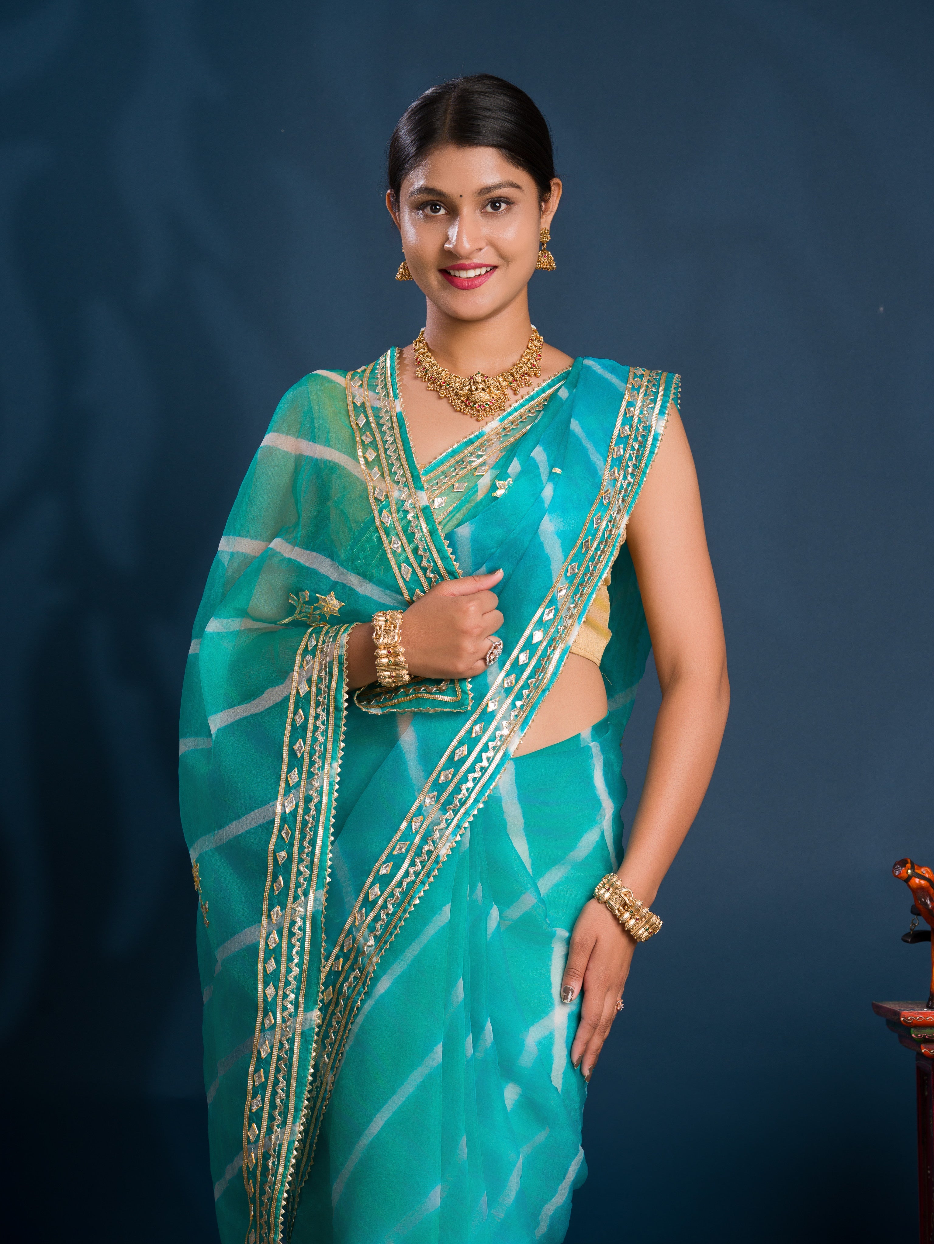 Teal sareewith Silver  patterns   Organza Leheriya Style With Gotapatti Work 