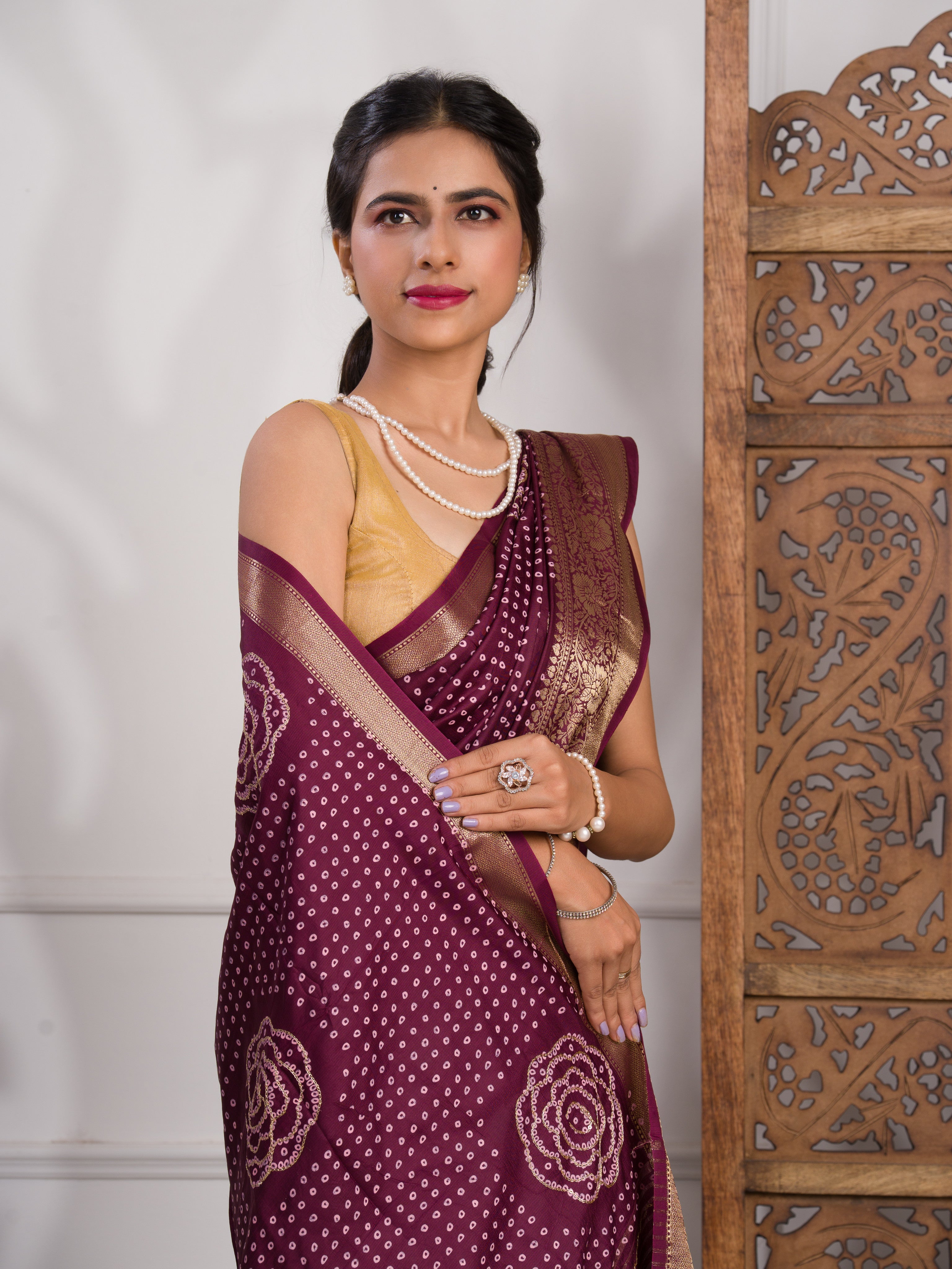 A wine and gold Upada silk saree with Bandhani style 