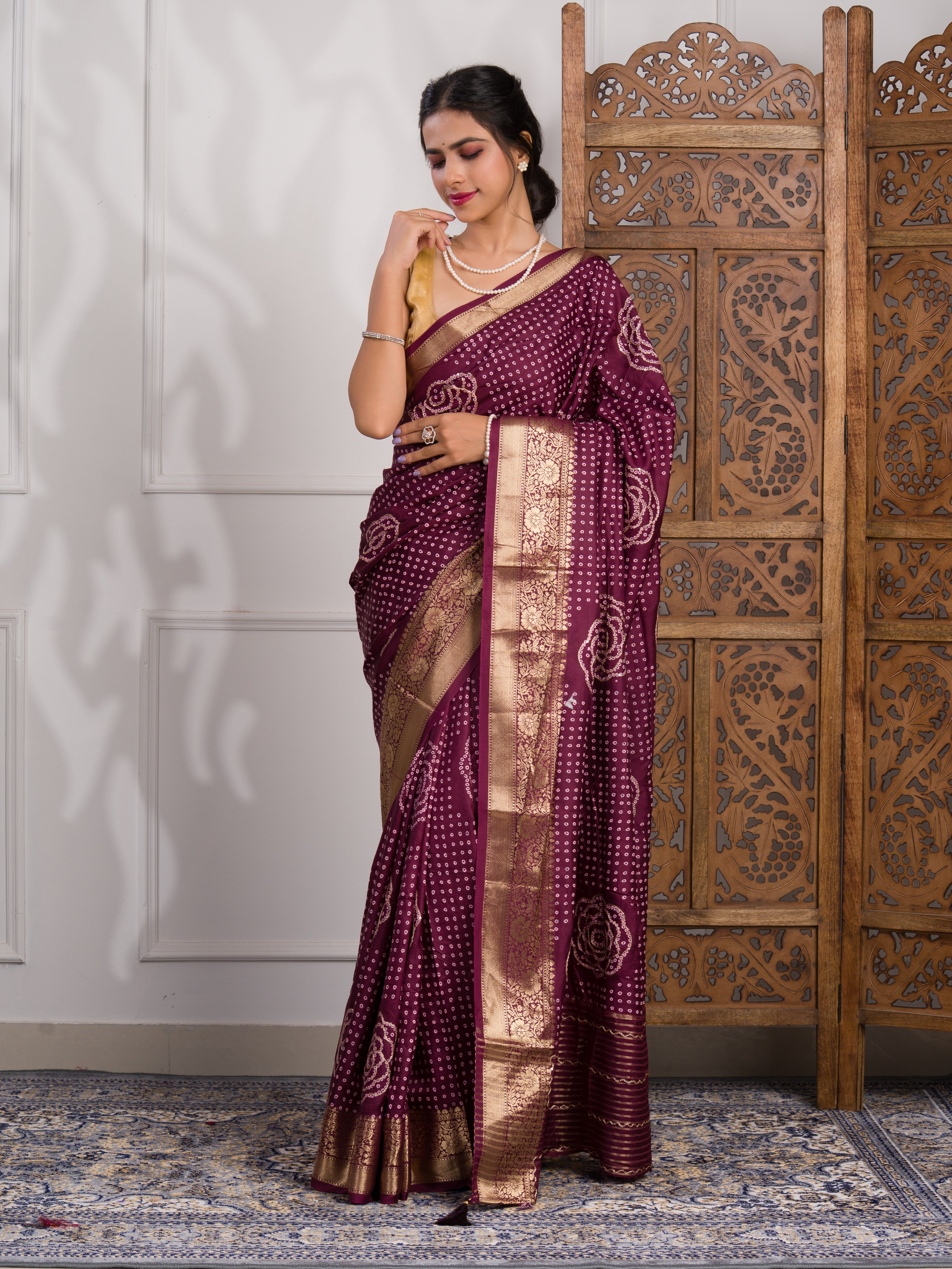 A wine and gold Upada silk saree with Bandhani style