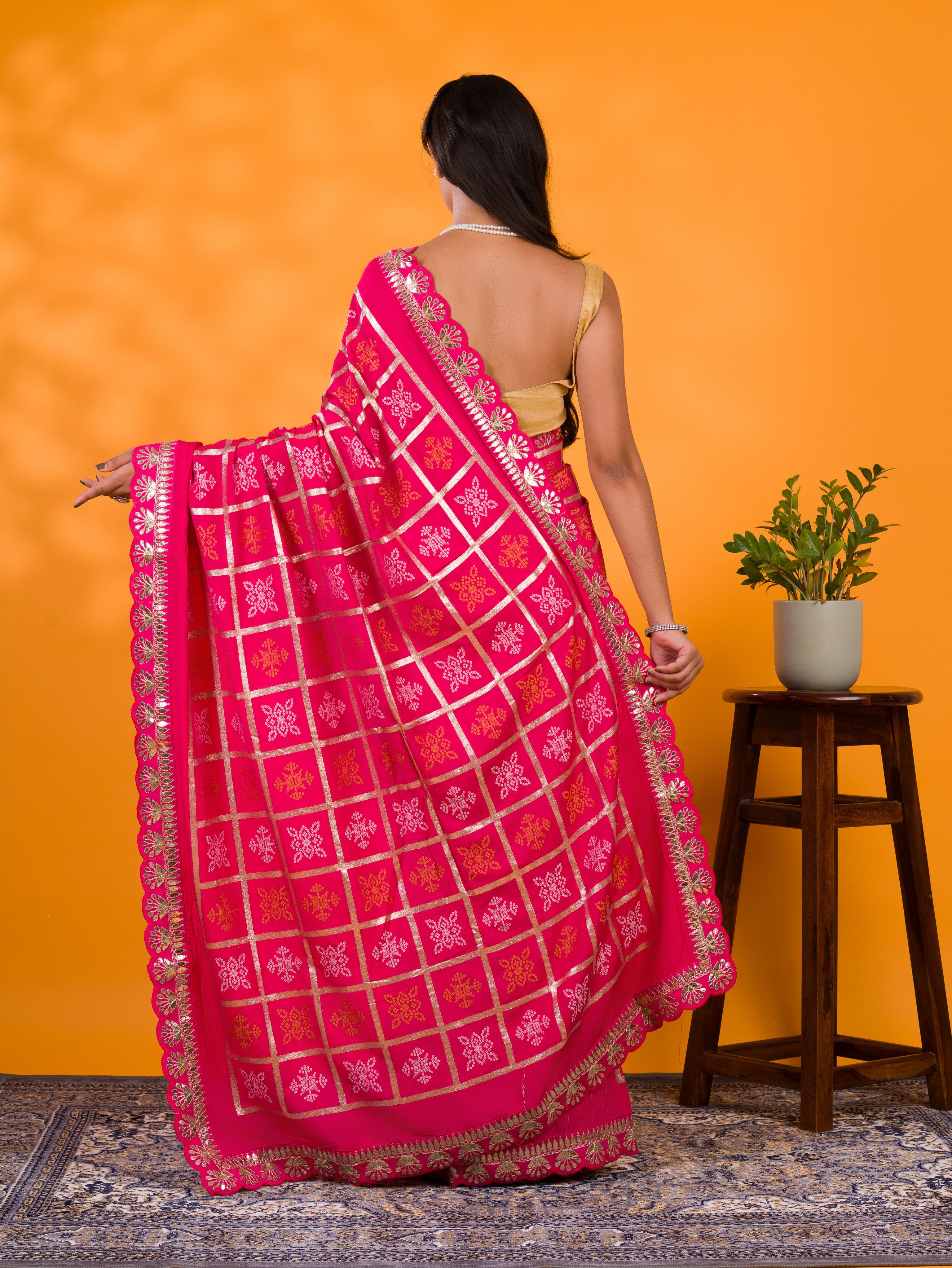 A pink saree with white patterns with  Cotton silk Bandhani Gotapatti Work Saree