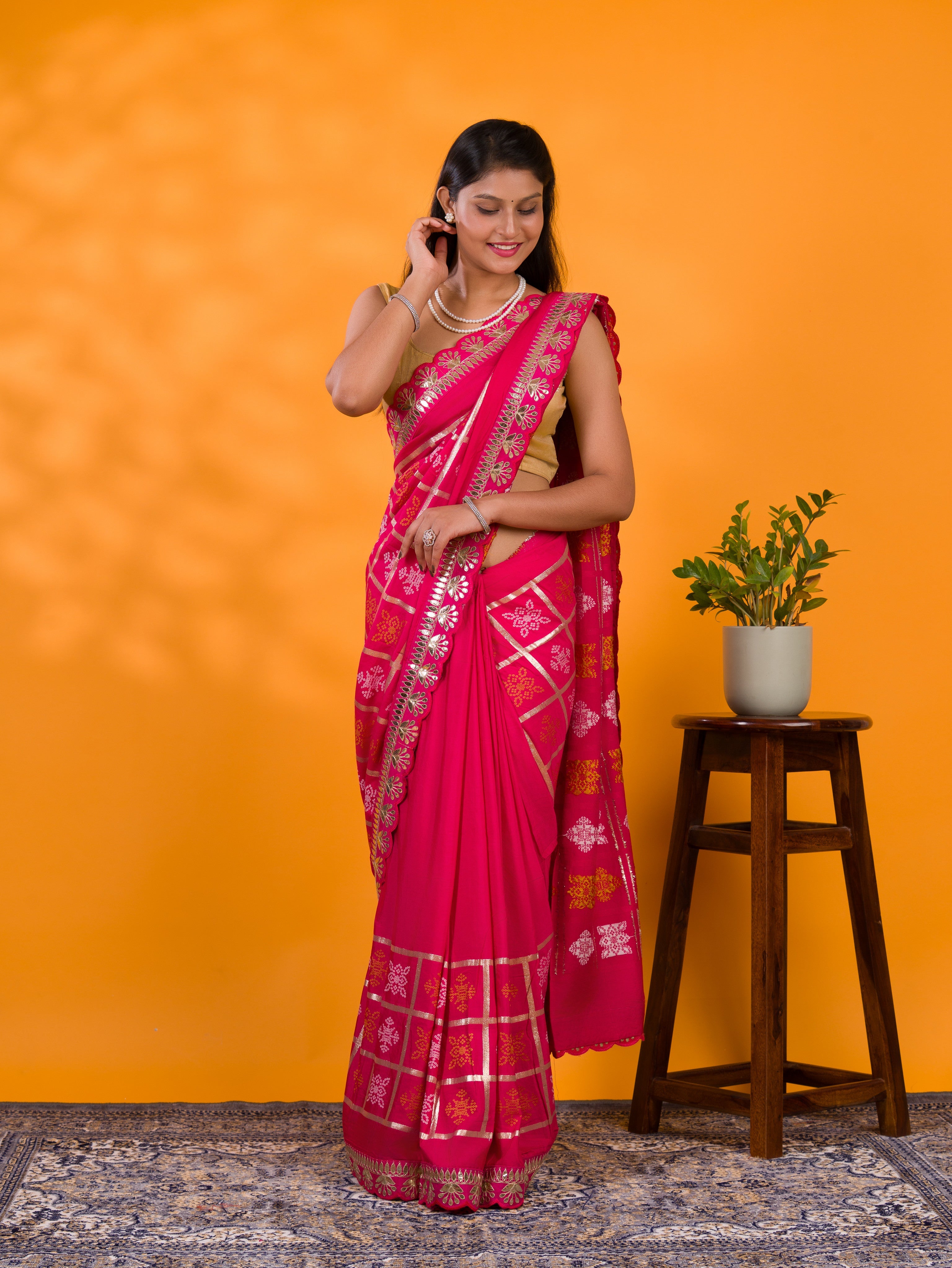 A pink saree with white patterns with  Cotton silk Bandhani Gotapatti Work Saree
