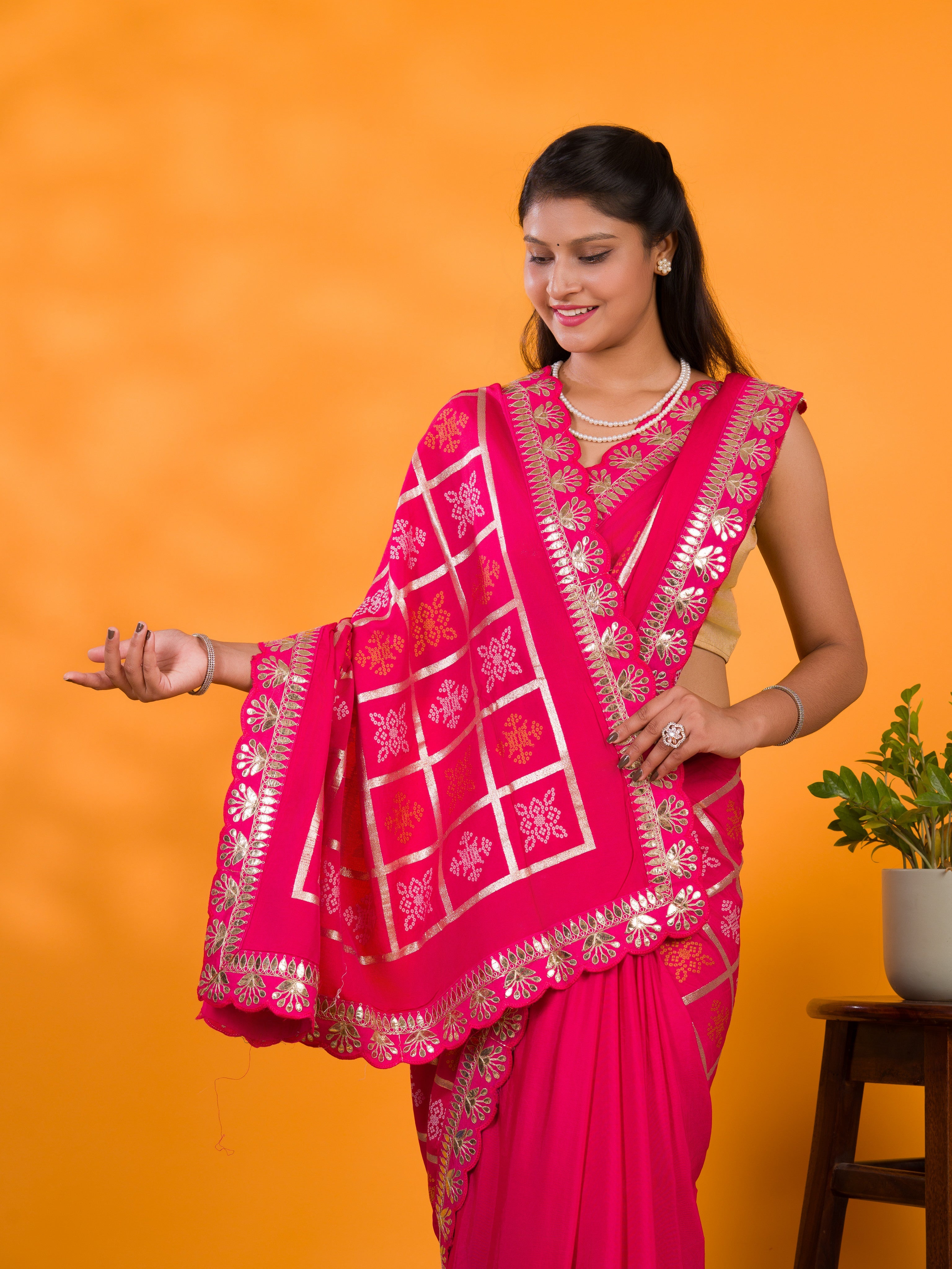 A pink saree with white patterns with  Cotton silk Bandhani Gotapatti Work Saree
