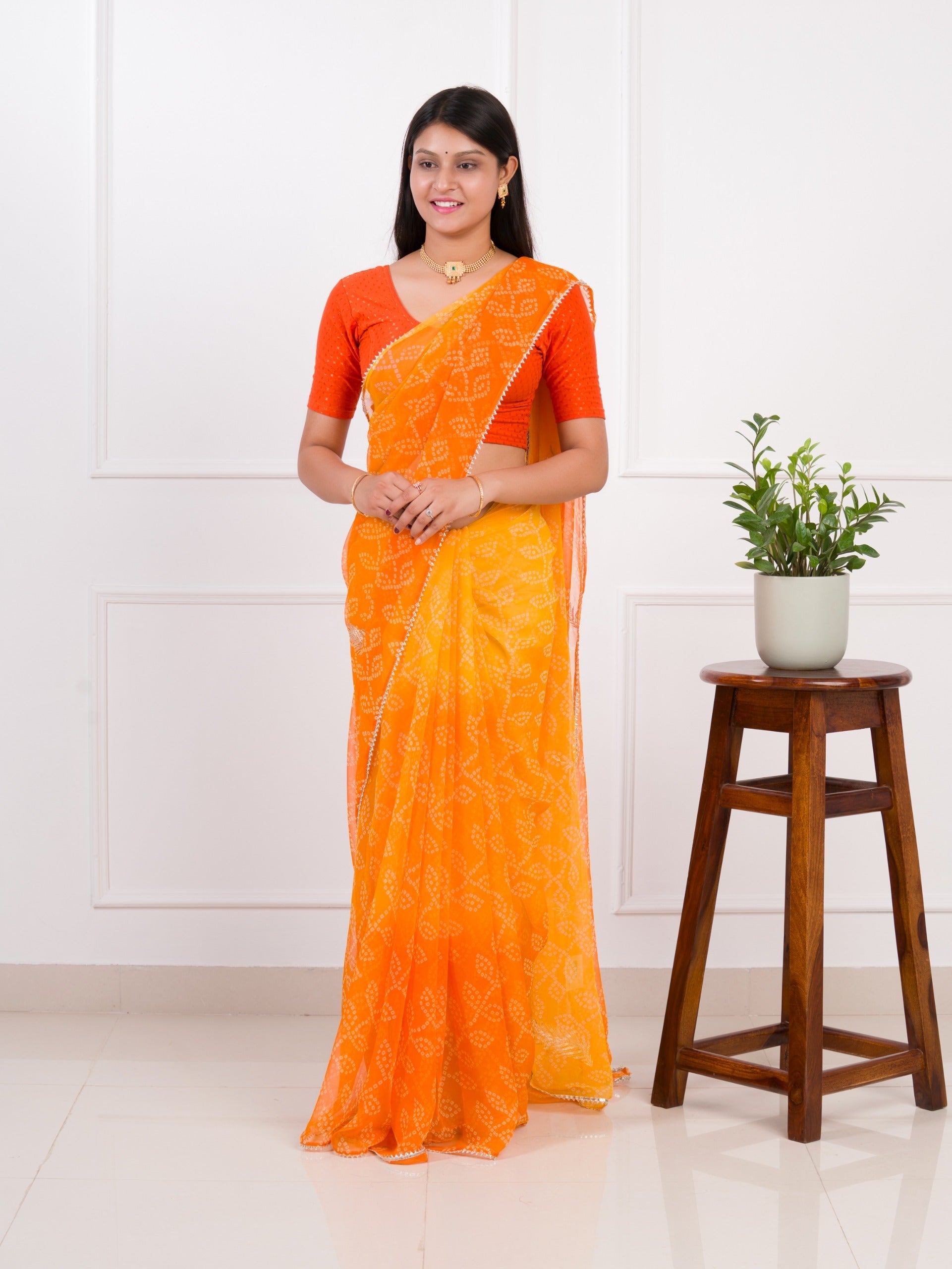 orange saree with a white print  Chiffon Bandhani style With Vintage Work Saree